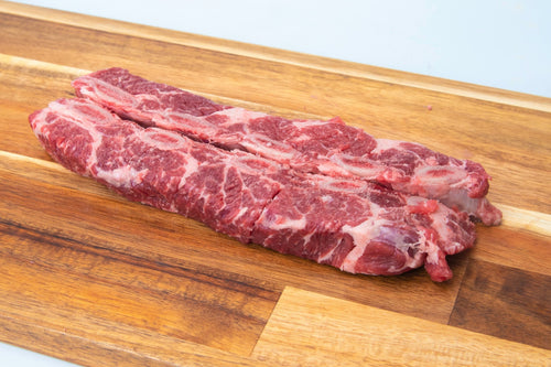 Beef Flanken Breast, raw, tender, flavorful cut for braising or stewing.