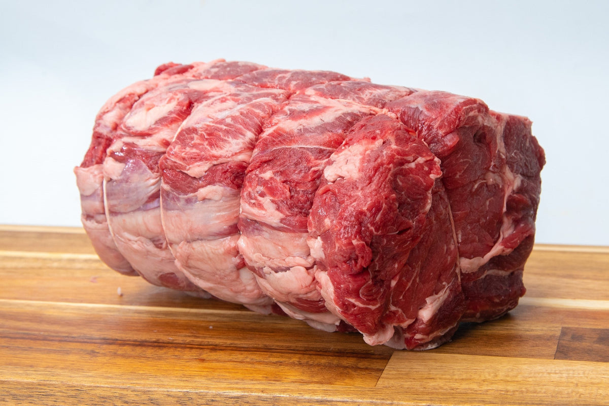 Prime beef standing rib roast, raw, bone-in, perfect for special occasions.